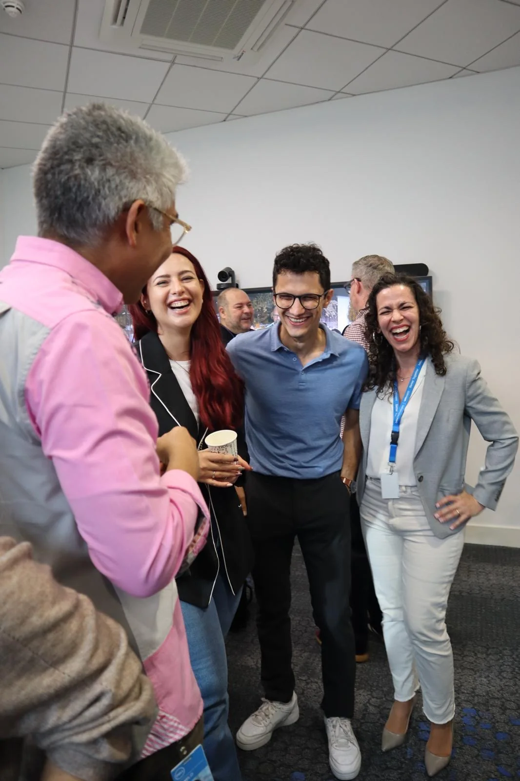 Marta laughing with colleagues